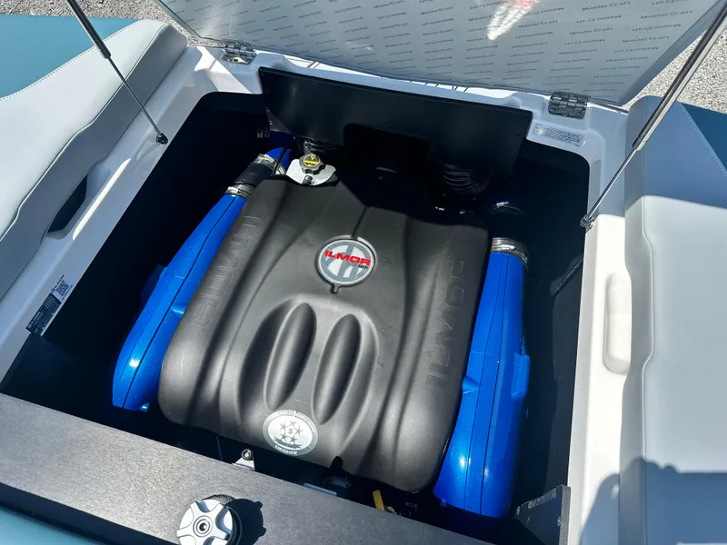 Slide: The Image of 2025 MasterCraft NXT21 engine compartment with Ilmor engine, showcasing modern design and engineering. - 2