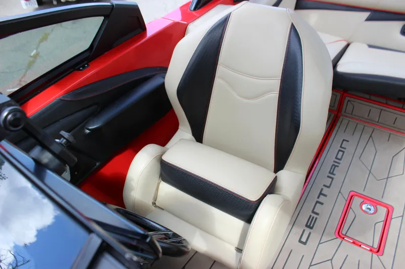 Slide: The Image of 2021 Centurion Fi21 boat interior with beige and black seating. - 30