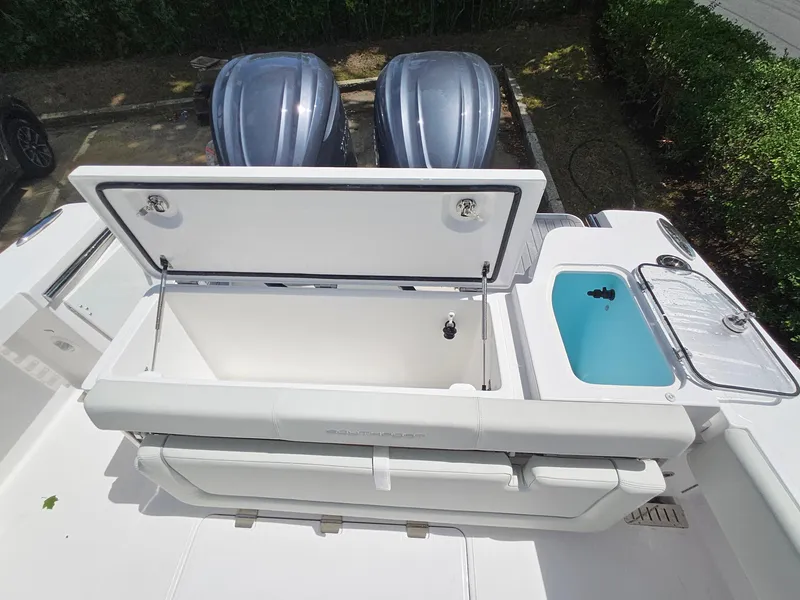 Slide: The Image of 2025 Southport 30 FE boat with open storage and twin engines. - 16