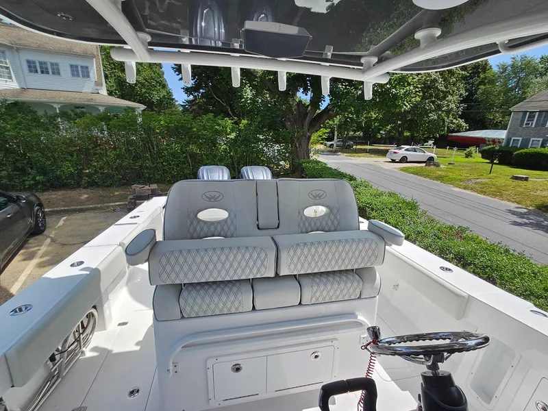 Slide: The Image of 2025 Southport 30 FE boat interior with cushioned seating and steering wheel. - 20