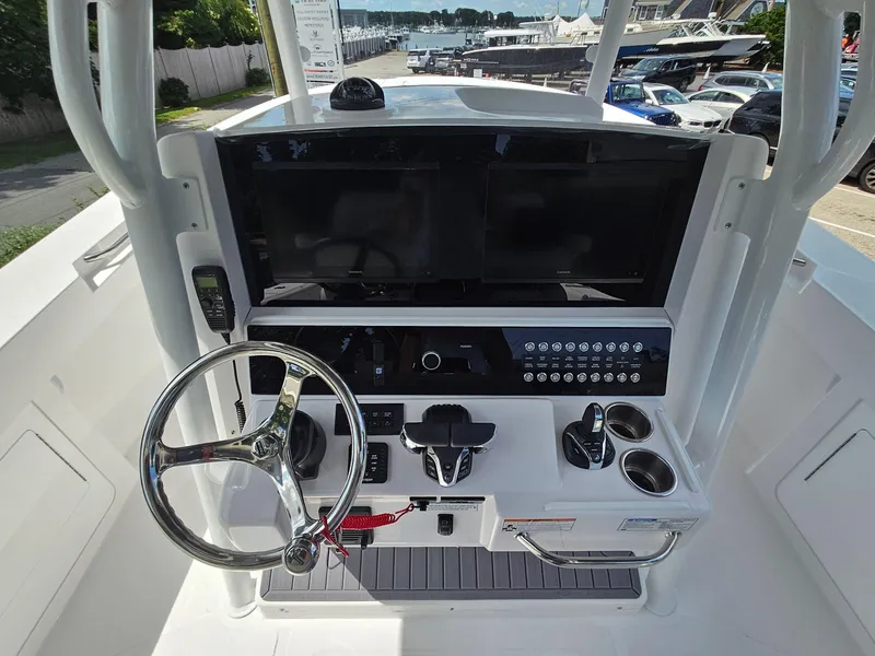 Slide: The Image of 2025 Southport 30 FE boat helm with modern controls and dual screens. - 21