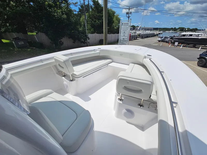 Slide: The Image of 2025 Southport 30 FE boat interior with white seating and open deck. - 25