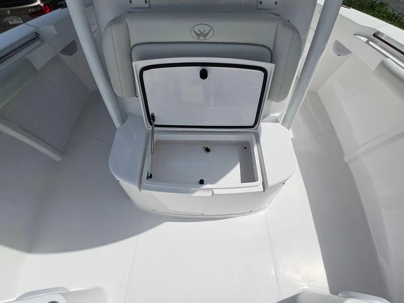 Slide: The Image of 2025 Southport 30 FE boat interior with open storage compartment. - 27