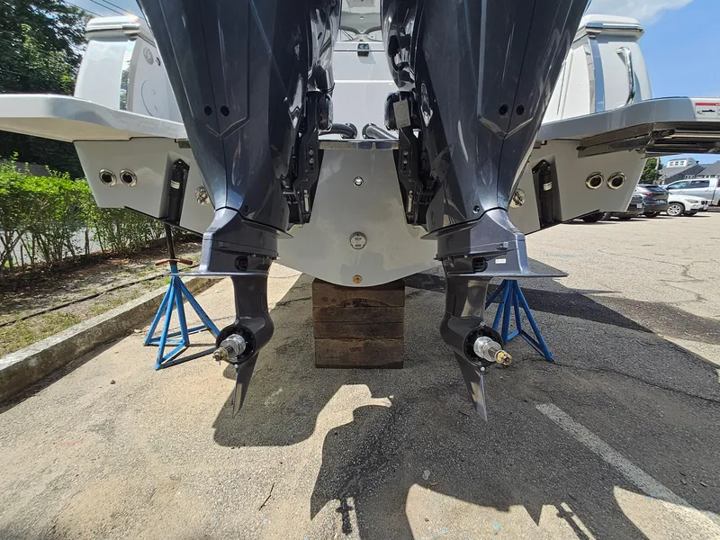 Slide: The Image of Rear view of 2025 Southport 30 FE boat with dual outboard motors. - 9