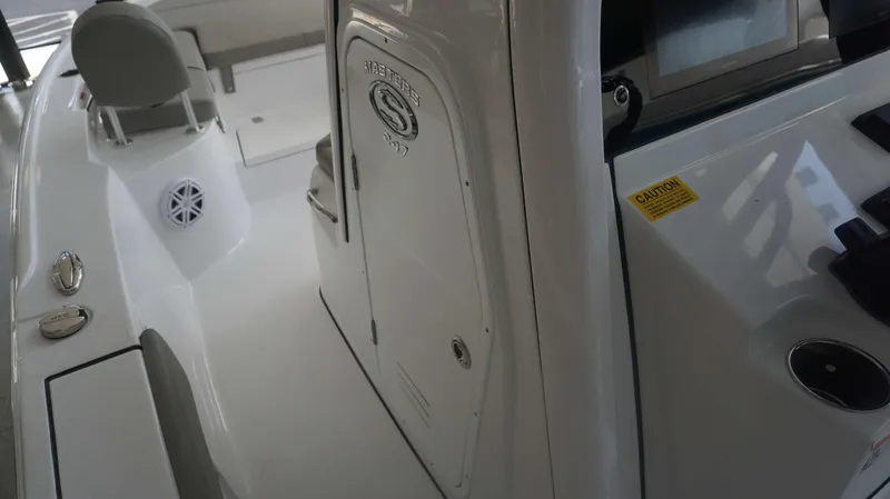 Slide: The Image of 2025 Sportsman 247 MASTERS boat interior, featuring seating and control panel. - 12