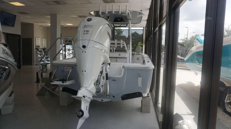 Slide: The Image of 2025 Sportsman 247 MASTERS boat with Yamaha 300 V6 engine in showroom. - 13