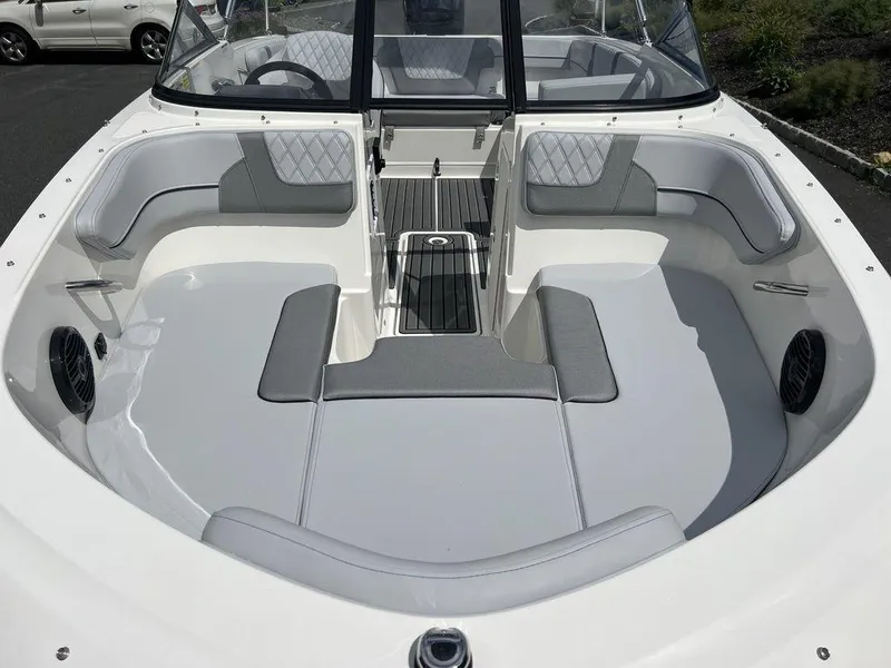 Slide: The Image of 2025 Bayliner VR4 Bowrider Outboard, spacious seating, modern design, white and gray interior. - 12