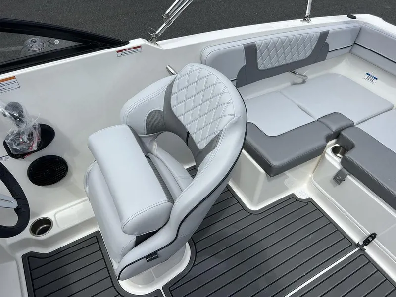 Slide: The Image of 2025 Bayliner VR4 Bowrider interior with gray seating and modern design. - 14