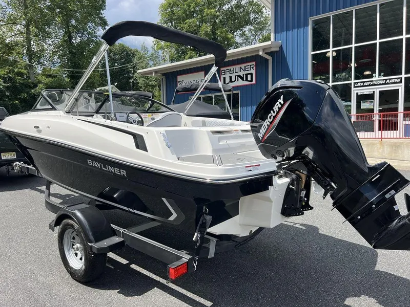 Slide: The Image of 2025 Bayliner VR4 Bowrider Outboard boat on trailer, displayed outdoors. - 3