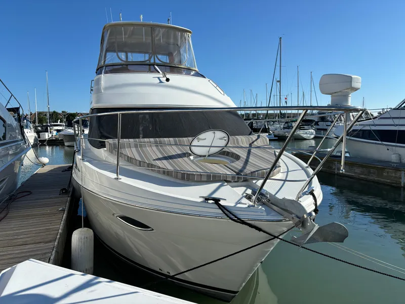 Slide: The Image of 2008 Carver 360 Sport Sedan yacht docked in marina under clear blue sky. - 11