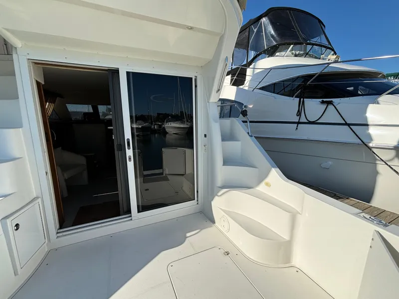 Slide: The Image of 2008 Carver 360 Sport Sedan yacht with sliding glass doors and exterior steps. - 13