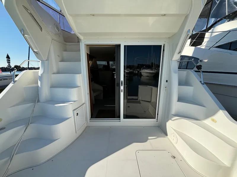 Slide: The Image of 2008 Carver 360 Sport Sedan yacht with dual staircases and sliding glass doors. - 14