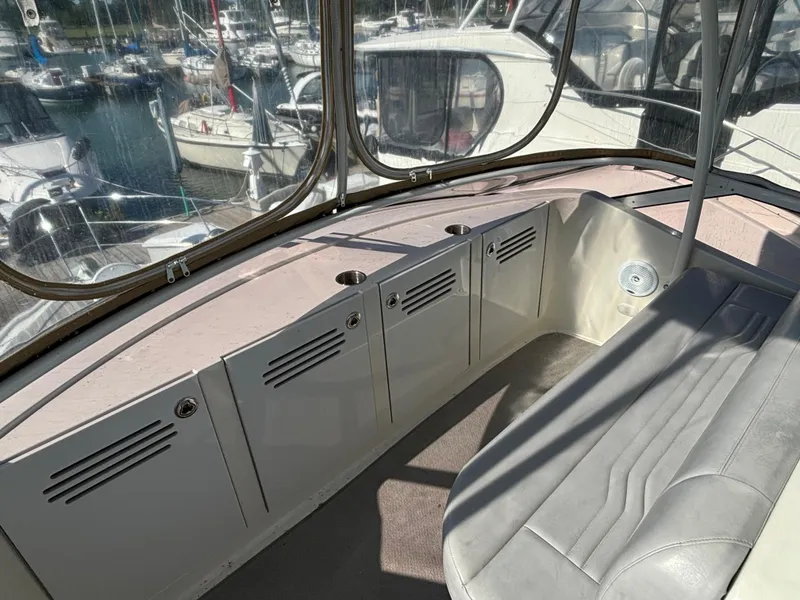 Slide: The Image of Interior of 2008 Carver 360 Sport Sedan with seating and storage, docked at marina. - 17
