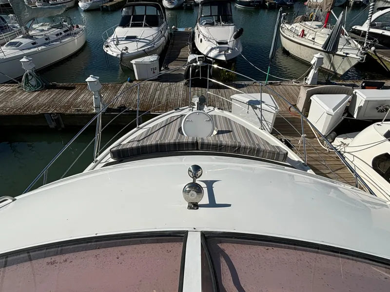 Slide: The Image of 2008 Carver 360 Sport Sedan docked at marina with other boats. - 22