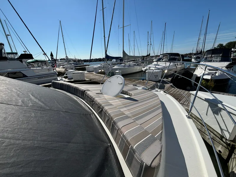 Slide: The Image of 2008 Carver 360 Sport Sedan docked at marina with other boats. - 25