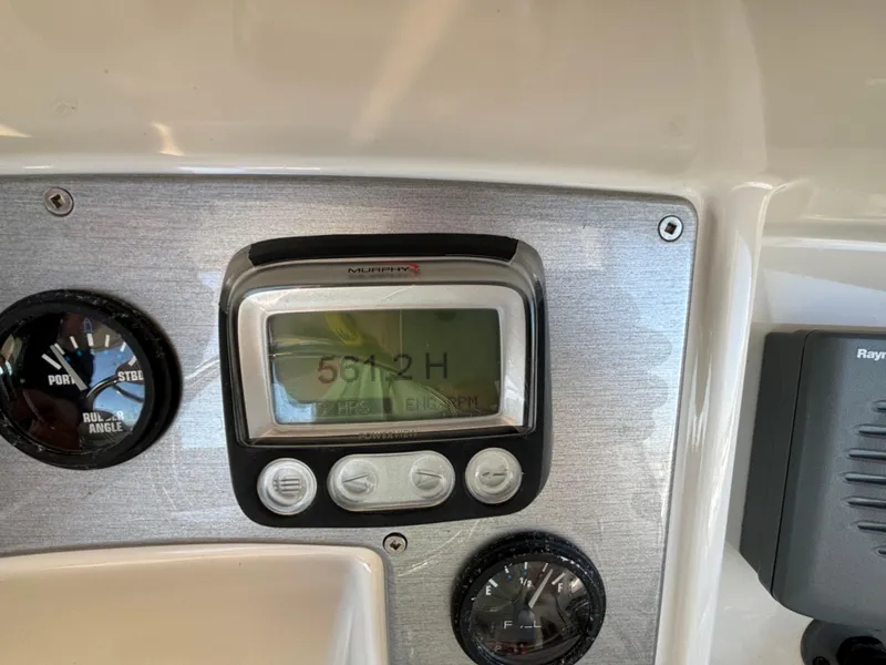 Slide: The Image of Dashboard of 2008 Carver 360 Sport Sedan with gauges and digital display. - 27