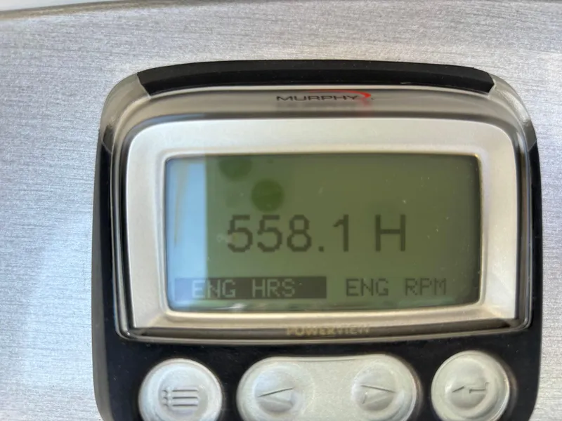 Slide: The Image of Engine hour meter displaying 558.1 hours on Carver 360 Sport Sedan, 2008 model. - 29