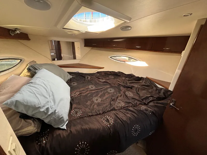 Slide: The Image of Interior cabin of 2008 Carver 360 Sport Sedan with cozy bed and porthole windows. - 3