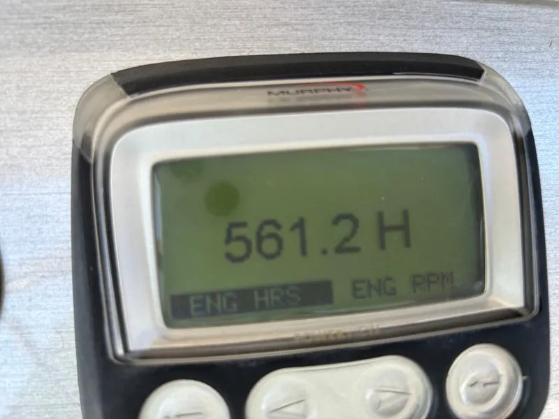 Slide: The Image of Engine hour meter displaying 561.2 hours on a 2008 Carver 360 Sport Sedan. - 30