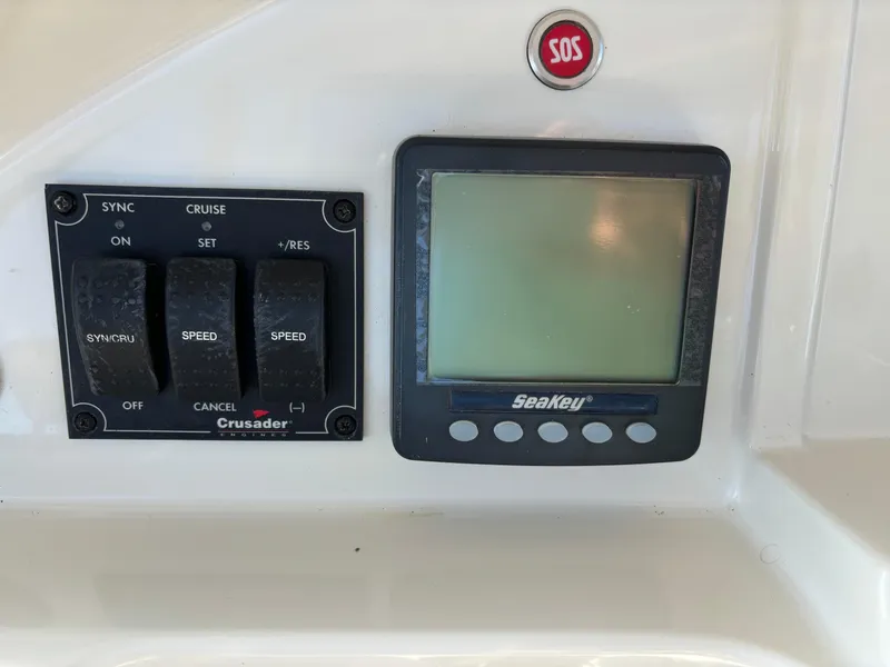 Slide: The Image of Control panel of a 2008 Carver 360 Sport Sedan with SeaKey display and SOS button. - 31