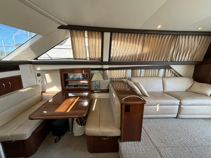 Slide: The Image of Interior of 2008 Carver 360 Sport Sedan with beige seating and wooden accents. - 42