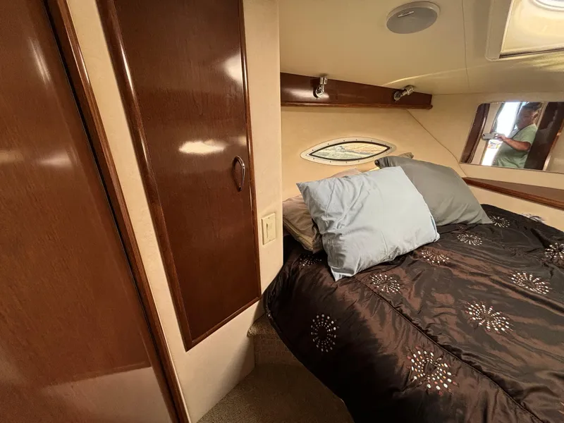 Slide: The Image of Interior cabin of 2008 Carver 360 Sport Sedan with cozy bed and wooden cabinetry. - 44