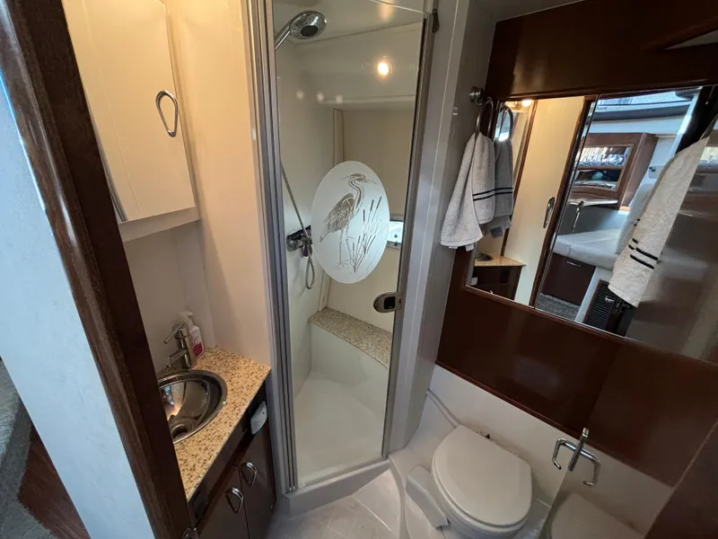 Slide: The Image of 2008 Carver 360 Sport Sedan bathroom with shower, sink, and toilet. - 47