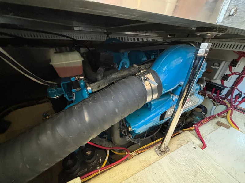 Slide: The Image of Engine compartment of 2008 Carver 360 Sport Sedan with visible hoses and wiring. - 49