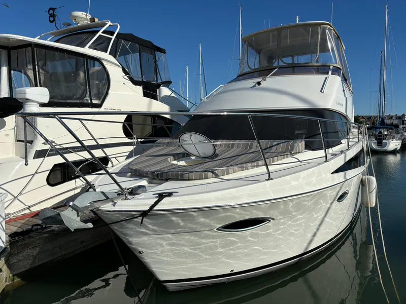 Slide: The Image of 2008 Carver 360 Sport Sedan yacht docked at marina under clear blue sky. - 6