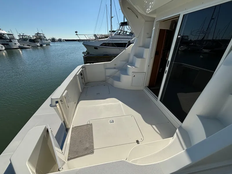 Slide: The Image of 2008 Carver 360 Sport Sedan yacht deck with marina view. - 7