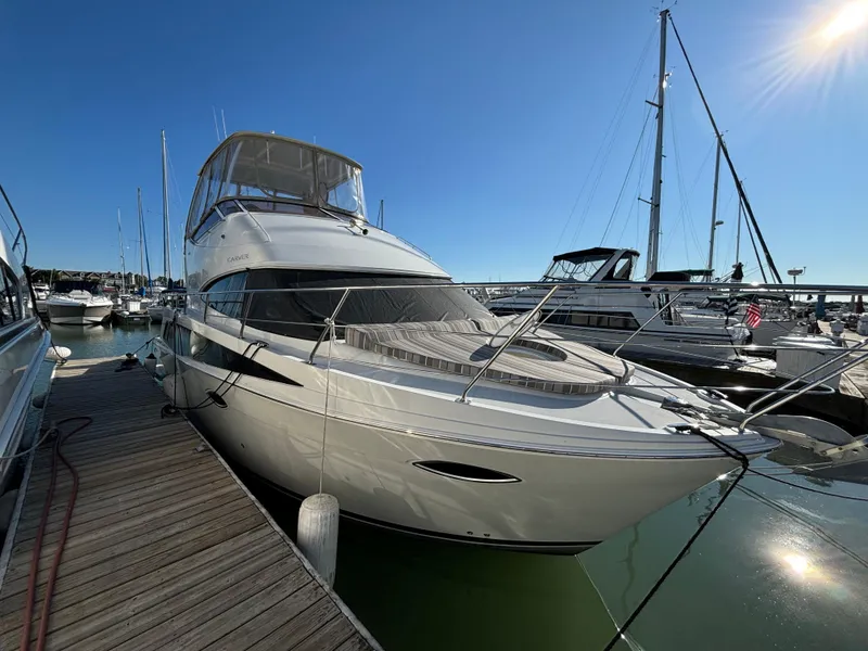 Slide: The Image of 2008 Carver 360 Sport Sedan yacht docked at marina under clear blue sky. - 9
