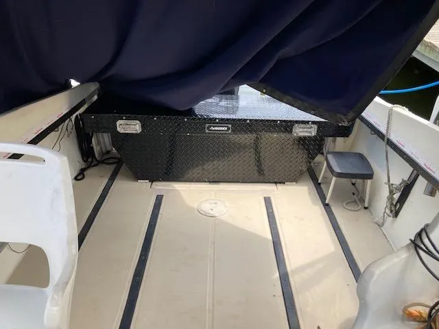 Slide: The Image of 1982 Albemarle 24 boat interior with seating and storage box. - 5