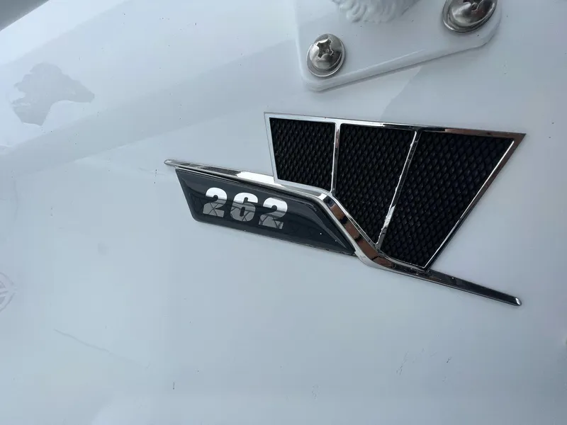 Slide: The Image of 2023 Wellcraft 262 Fisherman logo on white surface, featuring sleek design elements. - 15