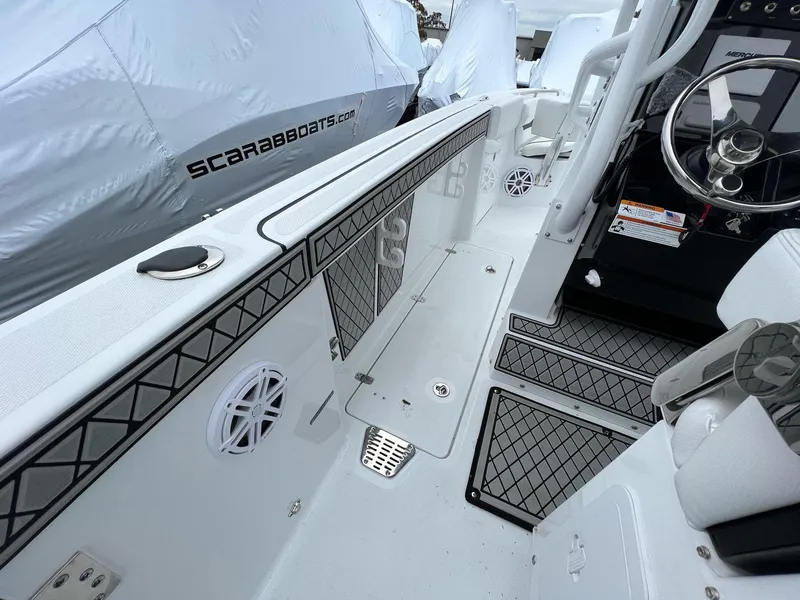 Slide: The Image of 2023 Wellcraft 262 Fisherman boat interior with modern design and steering console. - 17