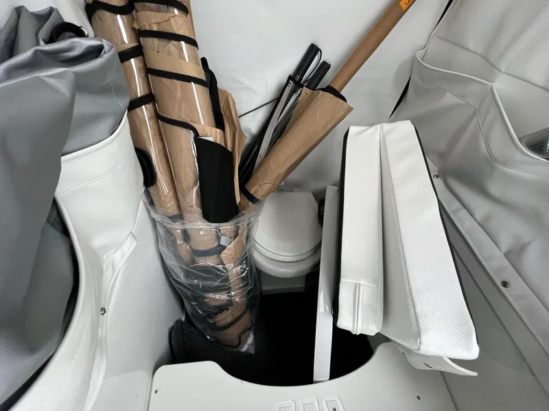 Slide: The Image of 2023 Wellcraft 262 Fisherman interior storage with fishing gear and equipment. - 25