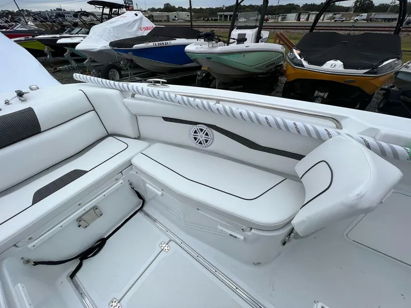 Slide: The Image of 2023 Wellcraft 262 Fisherman boat interior with white seating and storage compartments. - 29