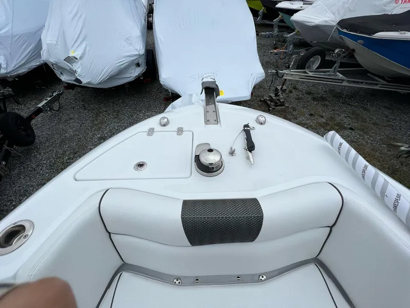 Slide: The Image of 2023 Wellcraft 262 Fisherman boat interior, featuring seating and deck details. - 31