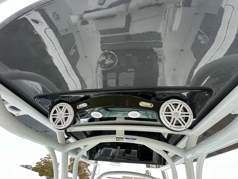 Slide: The Image of 2023 Wellcraft 262 Fisherman boat with sleek black roof and integrated speakers. - 40