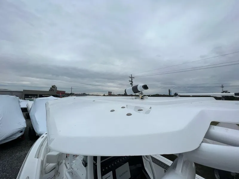 Slide: The Image of 2023 Wellcraft 262 Fisherman boat with radar, under cloudy sky. - 43