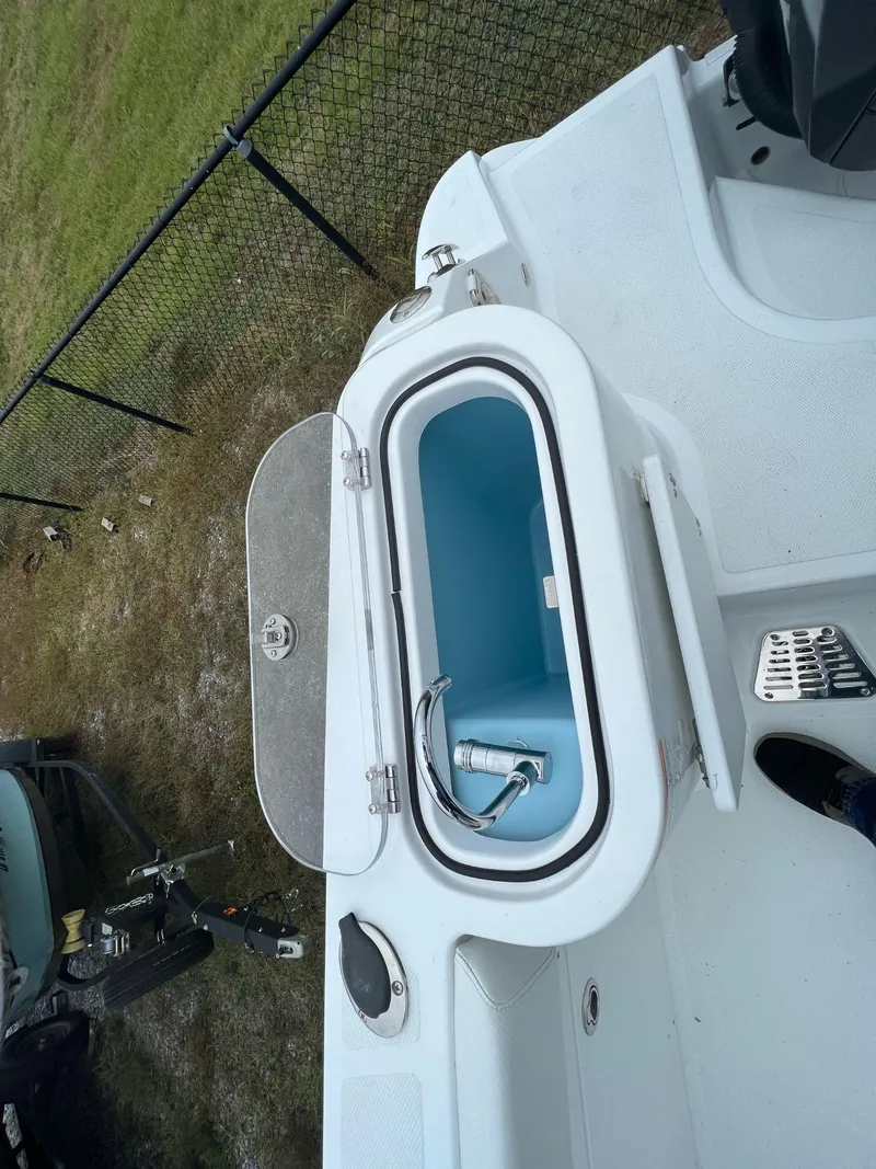 Slide: The Image of 2023 Wellcraft 262 Fisherman boat with open storage compartment. - 45