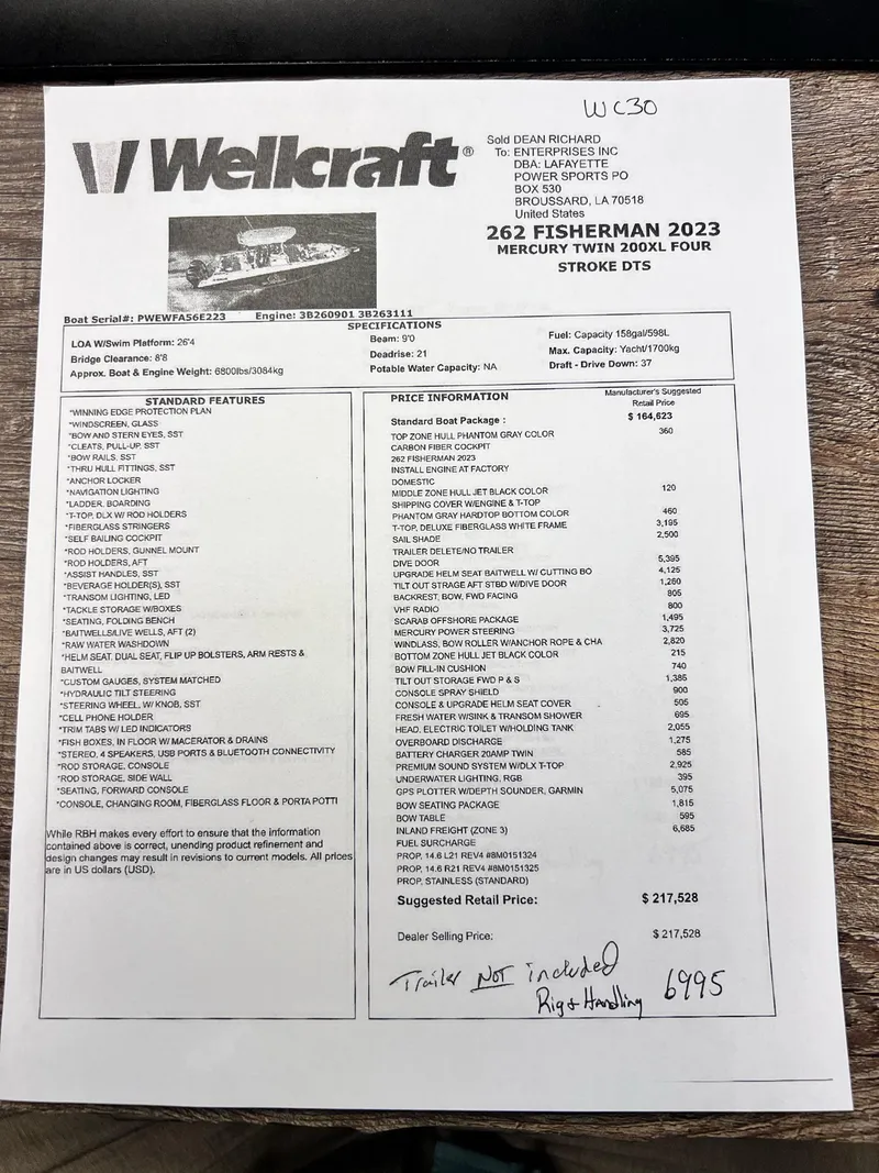 Slide: The Image of 2023 Wellcraft 262 Fisherman specifications and pricing sheet on wooden table. - 49