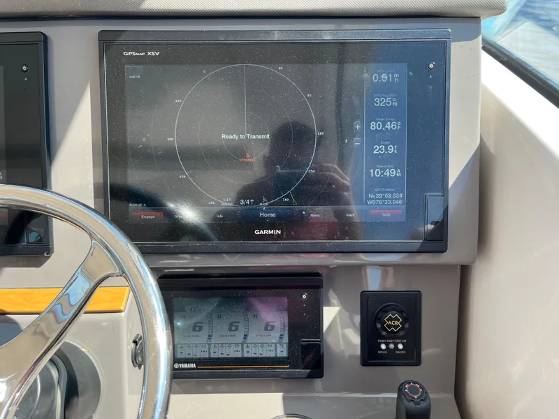 Slide: The Image of Garmin navigation display on 2018 Pursuit DC 365 Dual Console boat dashboard. - 25