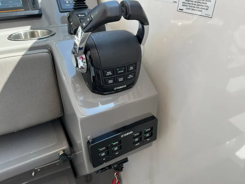 Slide: The Image of Yamaha throttle controls on 2018 Pursuit DC 365 Dual Console boat. - 27