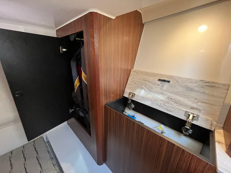 Slide: The Image of 2018 Pursuit DC 365 Dual Console interior storage compartments. - 35