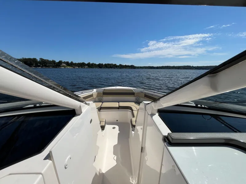 Slide: The Image of 2018 Pursuit DC 365 Dual Console boat on a sunny lake. - 41