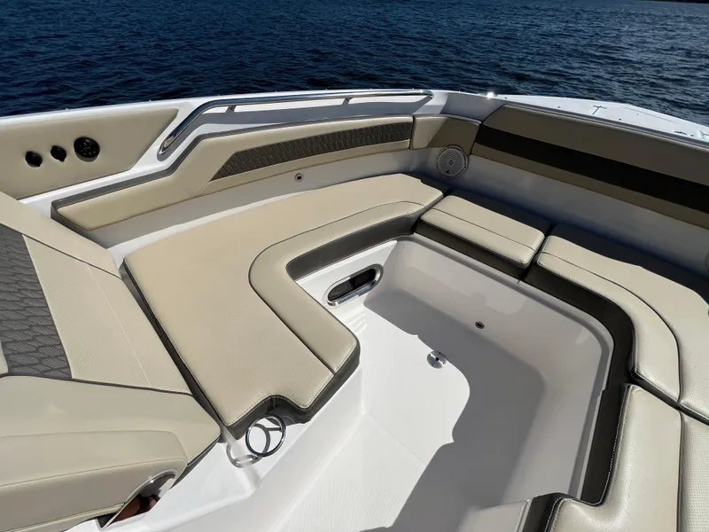 Slide: The Image of 2018 Pursuit DC 365 Dual Console boat with spacious seating area on calm water. - 42