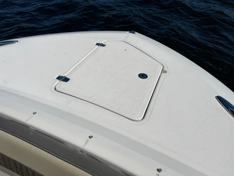 Slide: The Image of 2018 Pursuit DC 365 Dual Console boat deck on water. - 45