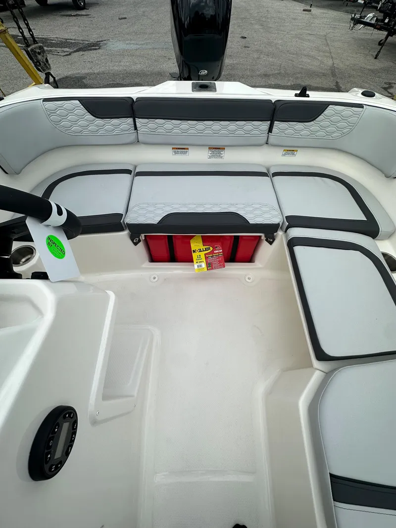 Slide: The Image of 2025 Bayliner M15 boat interior with cushioned seating and storage compartments. - 3