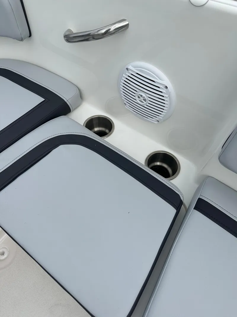 Slide: The Image of 2025 Bayliner M15 boat interior with speaker and cup holders. - 5
