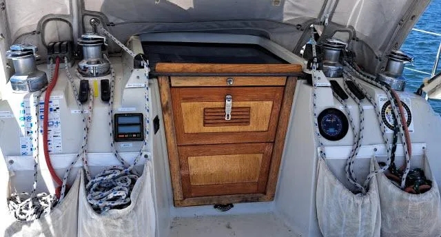 Slide: The Image of C&C 38 MKIII sailboat cockpit, 1987 model, featuring winches and wooden hatch. - 13